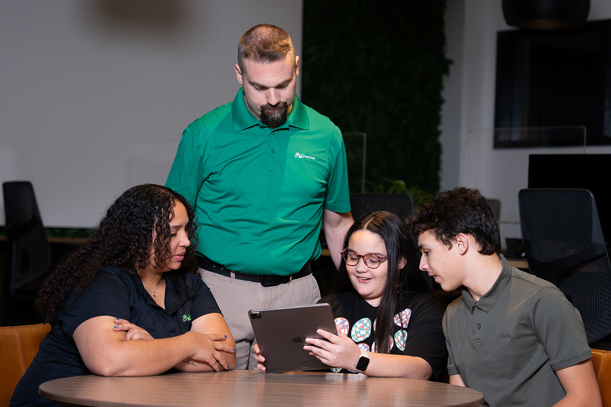 a group of people sitting at a table